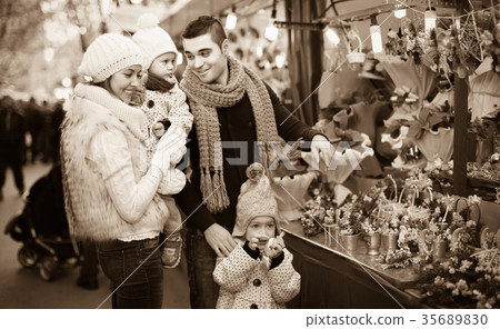 Happy family in Christmas fair Happy family in Christmas fair 35689830