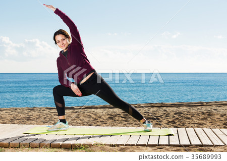 woman working out in beach 35689993