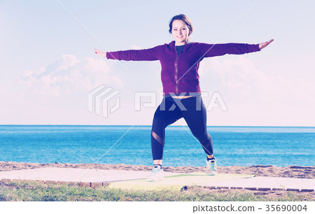 woman working out in beach 35690004