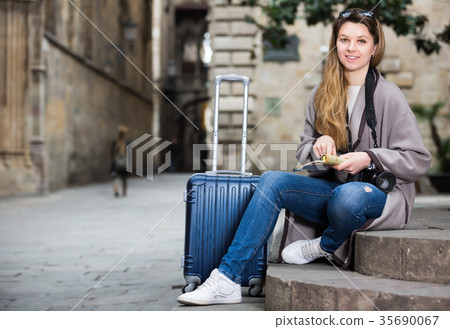 Girl holding brochure 35690067