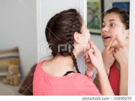 Girl cleaning pores Girl cleaning pores 35690255