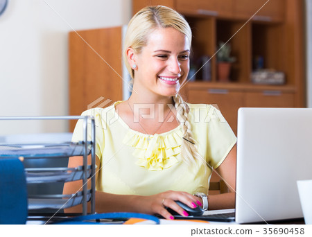 Business woman with notebook at work. Business woman with notebook at work. 35690458