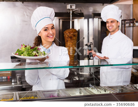 Staff posing at kebab counter 35690686