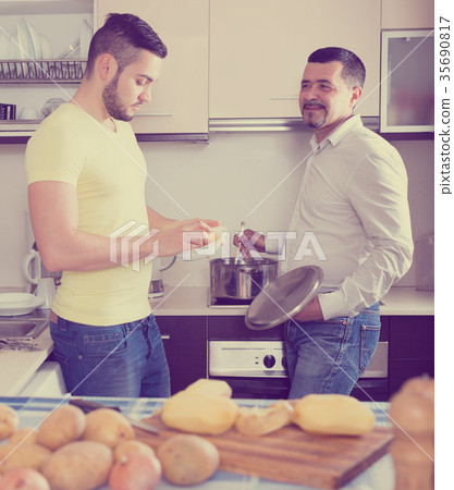men cooking potato soup 35690817