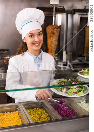 Female cook at bistro. 35690961