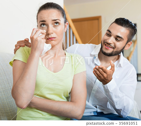 Young man talking to upset woman Young man talking to upset woman 35691051