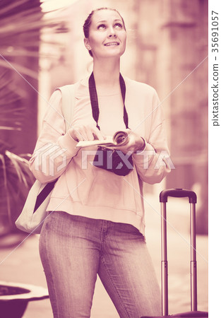 Young traveling girl searching for the direction Young traveling girl searching for the direction 35691057