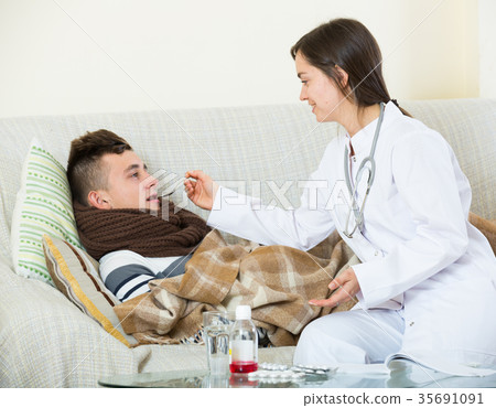 Female doctor treating teenager with syrup at home Female doctor treating teenager with syrup at home 35691091