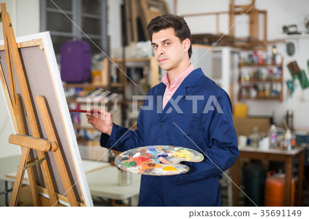 Male artist drawing in studio Male artist drawing in studio 35691149