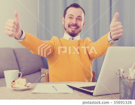 Smiling man communicate by video Smiling man communicate by video 35691326