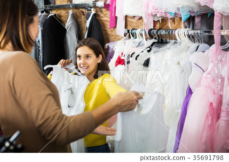 Family choosing dress in shop Family choosing dress in shop 35691798