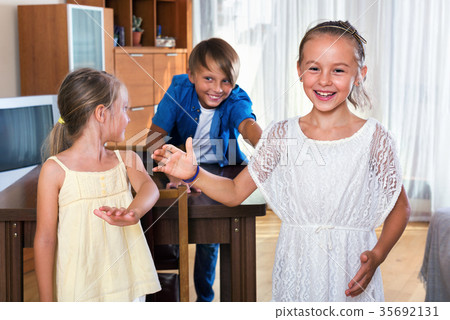 child chasing other kids to tag or touch them child chasing other kids to tag or touch them 35692131