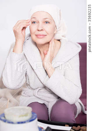 Woman cleaning face Woman cleaning face 35692235