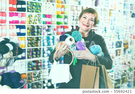 Client is standing with purchases Client is standing with purchases 35692421