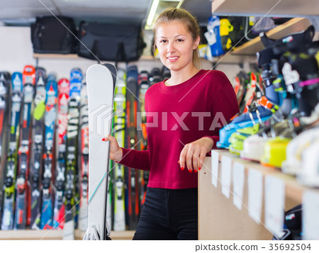Portrait of client girl who is standing with ski 35692504