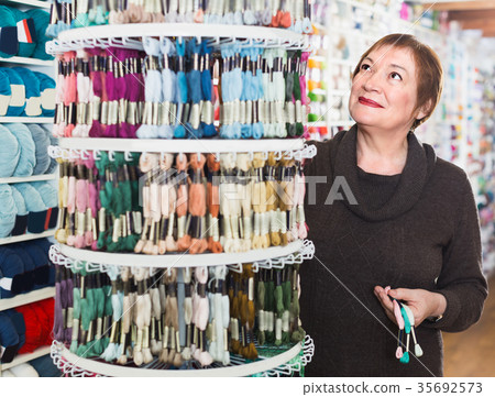 Mature female is buying colorful mouline threads Mature female is buying colorful mouline threads 35692573
