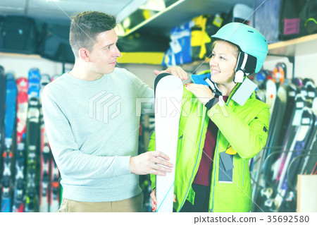 Shop assistant is helping woman Shop assistant is helping woman 35692580