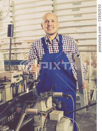 operator at professional lathe 35692650