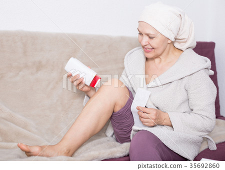 Woman doing body hair removal 35692860