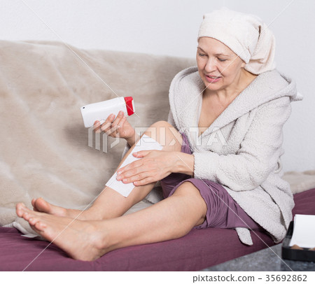 Woman doing body hair removal Woman doing body hair removal 35692862