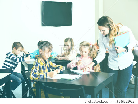 Little children with teacher in classroom 35692962