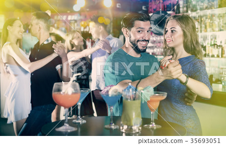 Female with man are dancing in bar Female with man are dancing in bar 35693051