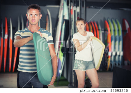 Couple with new surfboard Couple with new surfboard 35693226