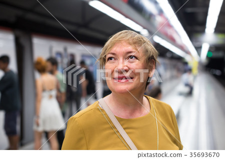 female passenger riding underground female passenger riding underground 35693670