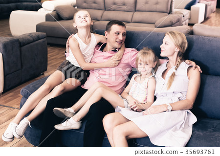 Family is satisfied by new bought sofa Family is satisfied by new bought sofa 35693761