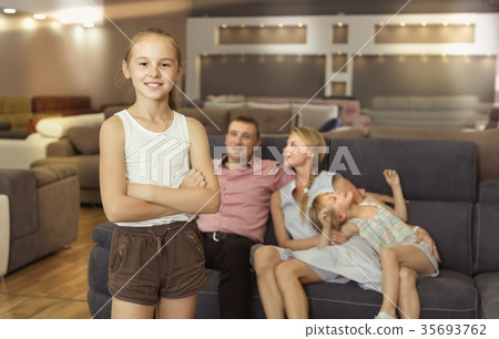 Girl 8-12 years old is happyning of new sofa Girl 8-12 years old is happyning of new sofa 35693762