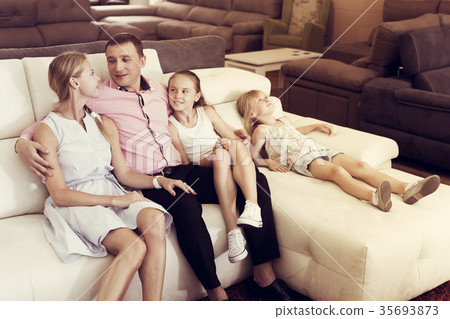 Parents with kids is pleased by new sofa 35693873