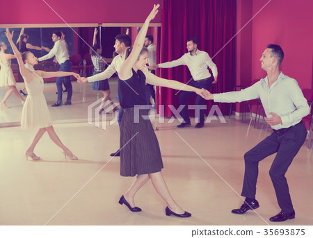 Joyful people dancing lindy hop in pairs 35693875
