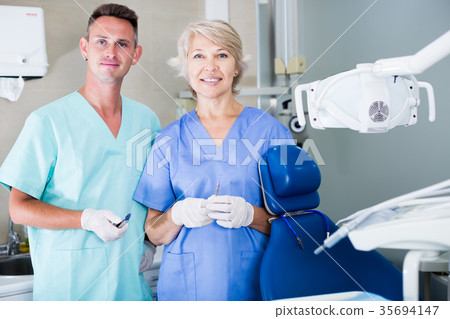 Two professional dentists posing in clinic 35694147