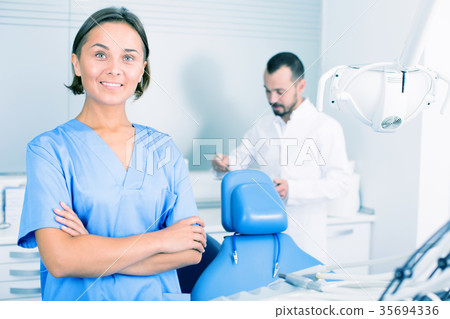 Portrait of dentist and assistant 35694336