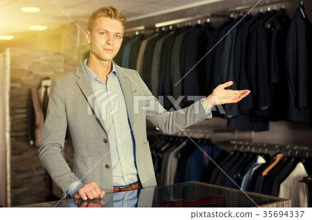 Male standing in the dress shop Male standing in the dress shop 35694337