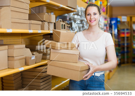 Positive girl with gift boxes Positive girl with gift boxes 35694533