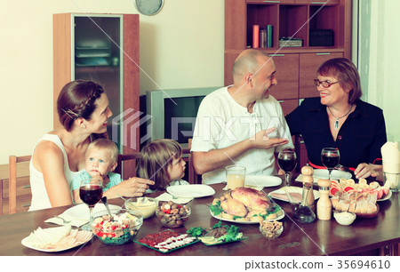 Portrait of happy multigeneration family communicate over holida Portrait of happy multigeneration family communicate over holida 35694610