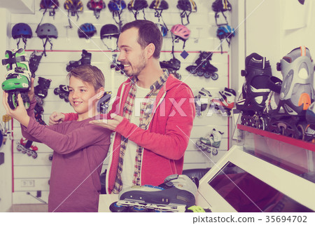 Son shows his choise of roller-skates 35694702