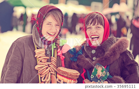 happy girls celebrating Shrovetide happy girls celebrating Shrovetide 35695111