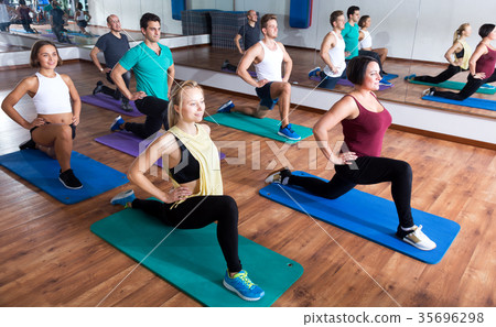 Adults having yoga class in sport club 35696298