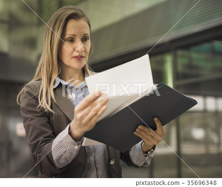 Employee woman with folder of documents 35696348