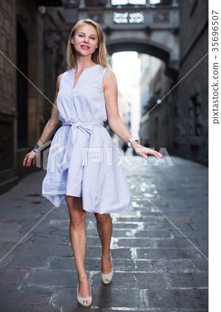 Glad female in the dress at the street Glad female in the dress at the street 35696507