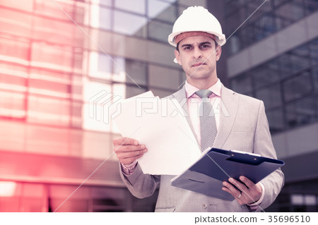 Businessman attentively reading documents 35696510