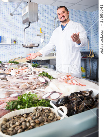 mature man standing near fish counter 35696541