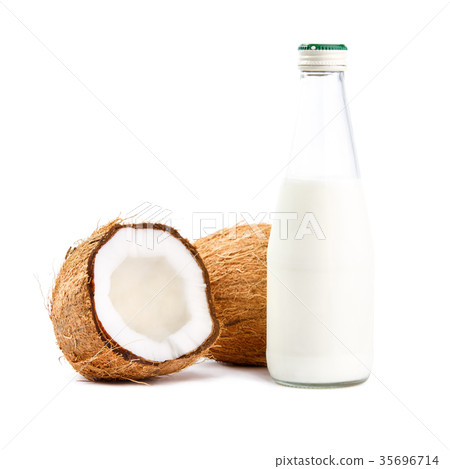 Whole and cut in half coconuts with coconut milk 35696714