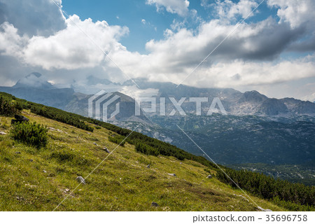 Scenic view of alps mountains a sunny day Scenic view of alps mountains a sunny day 35696758