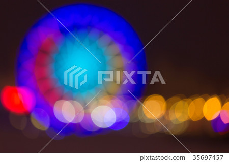Defocused ferris wheel with colorful lights Defocused ferris wheel with colorful lights 35697457