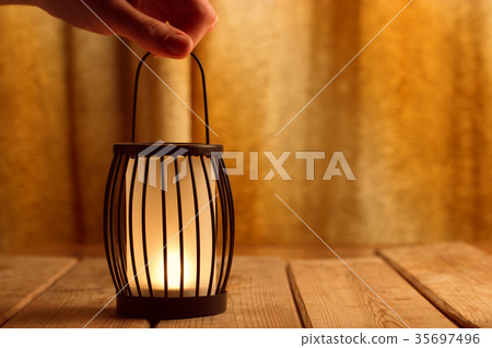 black lantern with a candle 35697496