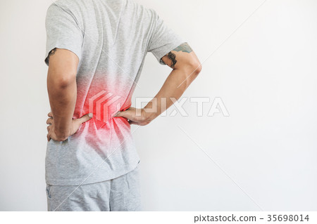 a man touching his back, backache and back pain a man touching his back, backache and back pain 35698014
