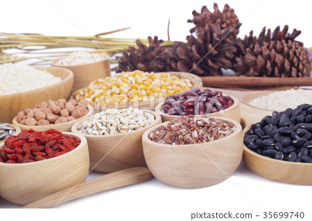 Cereal grains , seeds, beans on wooden background Cereal grains , seeds, beans on wooden background 35699740